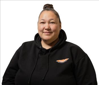 A SERVPRO® employee in front of a white background