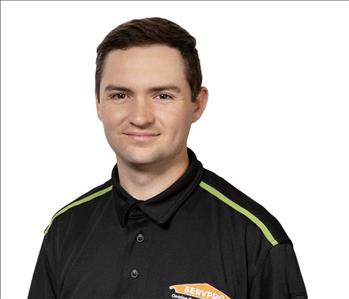 A SERVPRO® employee in front of a white background