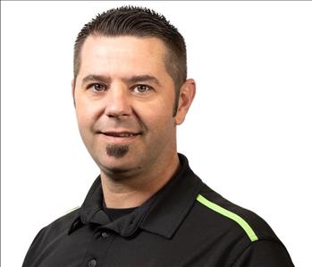 A SERVPRO® employee in front of a white background