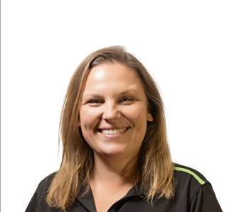 A SERVPRO® employee in front of a white background