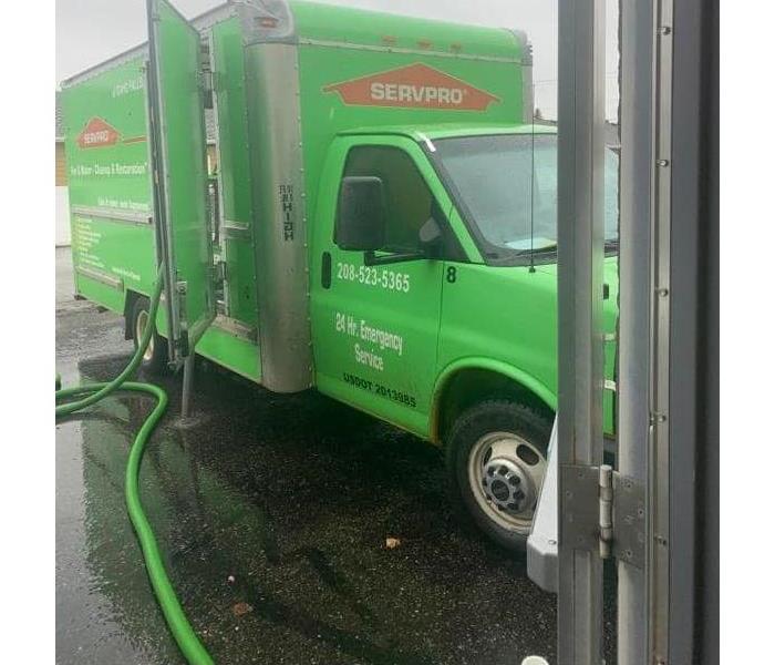 SERVPRO vehicle parked out in front of residential business