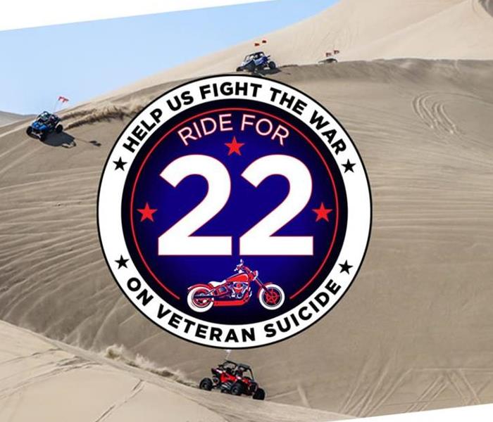 Four wheelers in sand dunes in background. Circle logo for Ride for 22